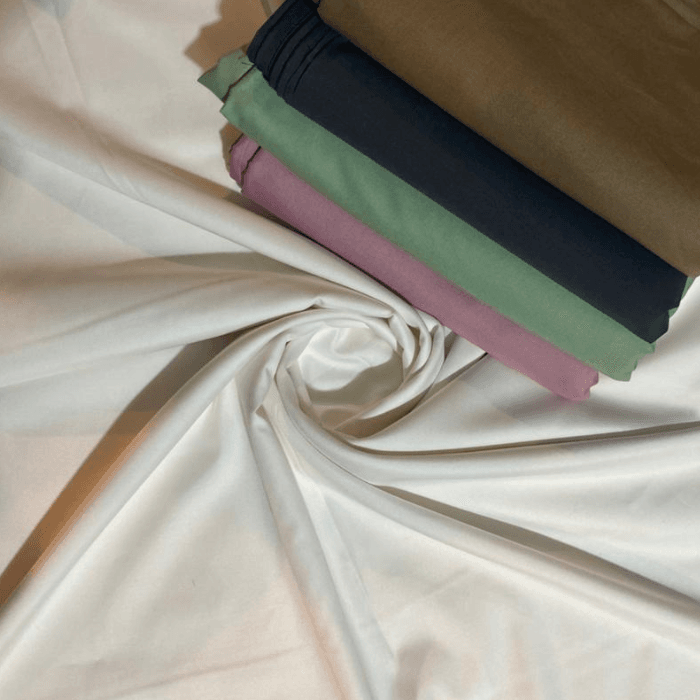 Gul Ahmed 100% pure men's suiting fabrics in white with folded khaki, black, green and rose shades
