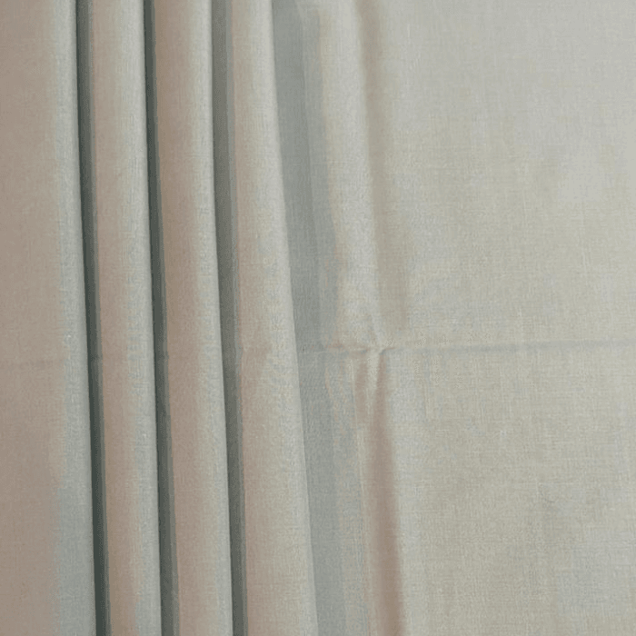 Cool off white men's suiting fabric with soft pleated drape