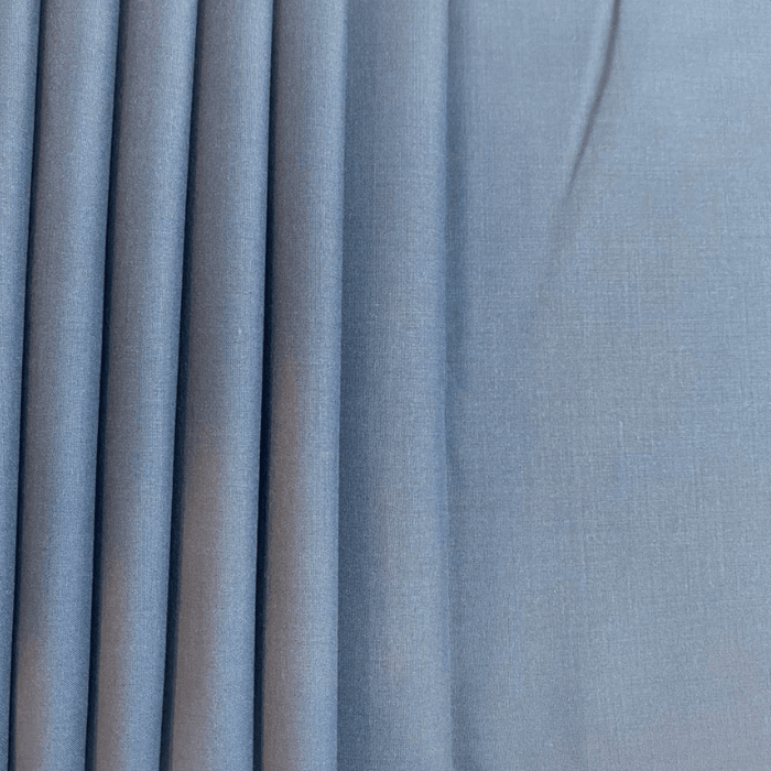 Slate gray denim blue men's suiting fabric with soft pleated drape